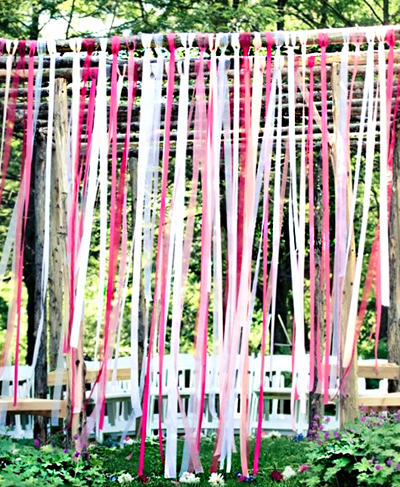 Ceremony backdrop with ribbon streamers