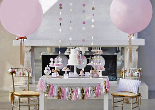dessert table with balloons